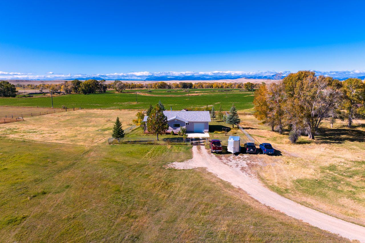 Aerial view of 20 Stenson Lane and the Rocky Mountain Front, Choteau, MT